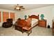 Spacious main bedroom features a wooden bed frame and nightstands with plenty of natural light at 9955 Orange Blossom Trl, Fishers, IN 46038