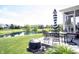 Covered patio with table and chairs overlooking a pond at 10267 Ranford Blvd, Fishers, IN 46040