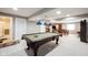 Finished basement with an amazing billiards table, with an adjacent bathroom and other entertainment spaces at 10267 Ranford Blvd, Fishers, IN 46040