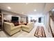 Finished basement featuring plush seating, modern decor, and ample space for relaxation and recreation at 10267 Ranford Blvd, Fishers, IN 46040