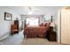 Well-lit bedroom boasts a decorative bed frame and comfortable carpet flooring at 10267 Ranford Blvd, Fishers, IN 46040