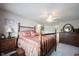 Light bedroom boasts a decorative bed frame, plush carpet flooring, and plenty of room for dressers at 10267 Ranford Blvd, Fishers, IN 46040