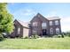 Beautiful two-story brick home featuring manicured lawn and landscaping at 10267 Ranford Blvd, Fishers, IN 46040