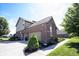 View of the exterior with three car garage and beautiful landscaping at 10267 Ranford Blvd, Fishers, IN 46040