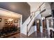 Elegant foyer with staircase, hardwood floors, and open view into the dining room at 10267 Ranford Blvd, Fishers, IN 46040