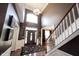Stunning two-story foyer with hardwood floors and elegant chandelier at 10267 Ranford Blvd, Fishers, IN 46040