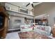 Open living area with high ceilings, and views to the kitchen and upstairs loft at 10267 Ranford Blvd, Fishers, IN 46040