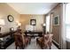 Inviting home office features a beautiful desk, elegant decor, and comfortable seating at 10267 Ranford Blvd, Fishers, IN 46040