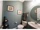 Stylish powder room with elegant fixtures, decorative artwork, and a neutral color scheme at 10267 Ranford Blvd, Fishers, IN 46040