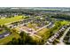 Aerial view of a Primary-planned community featuring ponds, green spaces, and modern single-Gathering homes at 10307 Gateway Dr, Brownsburg, IN 46234
