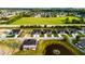 An aerial view of new homes with tree-lined streets and a large green space in the neighborhood at 10307 Gateway Dr, Brownsburg, IN 46234