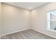 Cozy bedroom with carpeted floor, a window with view, and baseboard trim at 10307 Gateway Dr, Brownsburg, IN 46234