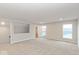 Spacious bonus room with carpet and multiple windows for natural light at 10307 Gateway Dr, Brownsburg, IN 46234