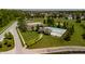 Aerial view of a community pool, playground, and green space in a well-maintained neighborhood at 10307 Gateway Dr, Brownsburg, IN 46234