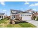 Charming home exterior with a well-manicured lawn and attached two-car garage at 10307 Gateway Dr, Brownsburg, IN 46234