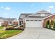 Charming single Gathering home featuring a two-car garage, beautiful landscaping, and brick accents at 10307 Gateway Dr, Brownsburg, IN 46234