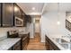 Gourmet kitchen featuring granite countertops, stainless steel appliances, and dark cabinetry at 10307 Gateway Dr, Brownsburg, IN 46234