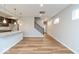 Open-concept living area featuring wood floors, a staircase, and a bright and airy atmosphere at 10307 Gateway Dr, Brownsburg, IN 46234