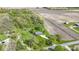 Stunning aerial view of a home on a sprawling lot with mature trees and agricultural fields at 10363 N County Road 950 E, Brownsburg, IN 46112