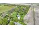 Gorgeous aerial shot of a home with well-manicured lawns, lush greenery, and neighboring fields at 10363 N County Road 950 E, Brownsburg, IN 46112
