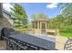 The back deck has a screened-in gazebo and a dining table for outdoor meals and entertaining at 10363 N County Road 950 E, Brownsburg, IN 46112