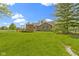 Aerial view of the home's backyard, showcasing the deck, gazebo, and lush yard at 10363 N County Road 950 E, Brownsburg, IN 46112