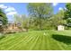 A well-maintained lawn features a back deck, gazebo, and storage shed at 10363 N County Road 950 E, Brownsburg, IN 46112