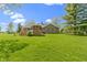 Aerial view of the home's backyard, showcasing the deck, gazebo, and well-maintained lawn at 10363 N County Road 950 E, Brownsburg, IN 46112