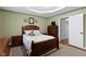 Cozy bedroom with carpeted floors, dresser, closet, and a comfortable bed at 10363 N County Road 950 E, Brownsburg, IN 46112