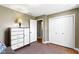 Bedroom featuring a dresser with drawers, closet doors, and an open doorway to another room at 10363 N County Road 950 E, Brownsburg, IN 46112