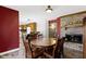 Spacious dining area showcases a wood table, fireplace, and adjoins the kitchen, perfect for gatherings at 10363 N County Road 950 E, Brownsburg, IN 46112