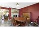 Inviting dining room features a brick fireplace, wood table, and access to the living room at 10363 N County Road 950 E, Brownsburg, IN 46112