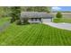 Charming single-story home with well-manicured lawn, attached garage, and inviting front porch at 10363 N County Road 950 E, Brownsburg, IN 46112
