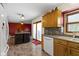 Kitchen features an island, sink with window, view to dining area, and ample lighting at 10363 N County Road 950 E, Brownsburg, IN 46112
