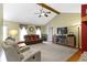 Spacious living room with vaulted ceiling, ceiling fan, and comfortable seating arrangement at 10363 N County Road 950 E, Brownsburg, IN 46112
