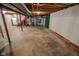 Spacious unfinished basement area with exposed ceiling beams, mechanicals, and potential for customization at 10827 Wonderland Dr, Indianapolis, IN 46239