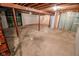 Unfinished basement with concrete floor, exposed ceiling, and wooden framing at 10827 Wonderland Dr, Indianapolis, IN 46239