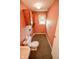 Powder room featuring a toilet, sink, and vanity at 10827 Wonderland Dr, Indianapolis, IN 46239