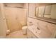 Bathroom with white walls, tiled floors, enclosed shower, and a sink with cabinet at 10827 Wonderland Dr, Indianapolis, IN 46239