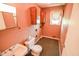 Powder room features a toilet, sink, and vanity at 10827 Wonderland Dr, Indianapolis, IN 46239
