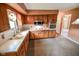 Kitchen with wooden cabinets, white countertops, and modern appliances at 10827 Wonderland Dr, Indianapolis, IN 46239