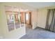 Bright living room with neutral carpet and lovely natural light at 10827 Wonderland Dr, Indianapolis, IN 46239