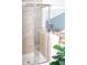 The bathtub and shower feature a sliding glass door and tile surround in the bathroom at 10835 Spirit Dr, Ingalls, IN 46048