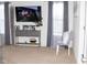 A living area with neutral colored walls, a television, decorative console and carpeted floors at 10835 Spirit Dr, Ingalls, IN 46048