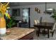 The living room and dining area features dark furniture and plants with a neutral wall color at 10835 Spirit Dr, Ingalls, IN 46048