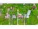 Birds eye view of a property with a green lawn and a detached garage at 1107 N Hartman Dr, Indianapolis, IN 46219