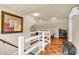 Spacious attic featuring hardwood floors, detailed trim, and natural light at 1107 N Hartman Dr, Indianapolis, IN 46219