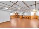 Spacious basement with drop ceiling, wood accent walls, and ample space for storage or entertainment at 1107 N Hartman Dr, Indianapolis, IN 46219