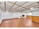 Finished basement featuring paneled accent walls, recessed lighting, and an entertainment center with a fireplace at 1107 N Hartman Dr, Indianapolis, IN 46219