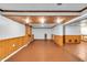 Finished basement offers ample space and features stylish wood paneling at 1107 N Hartman Dr, Indianapolis, IN 46219